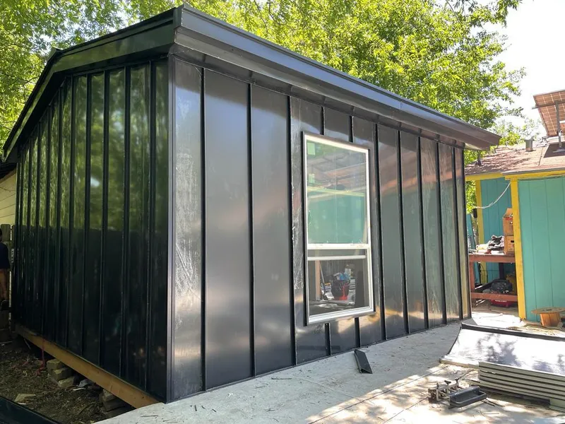 Black standing seam metal wall panels for Roof Inspection in Fitchburg